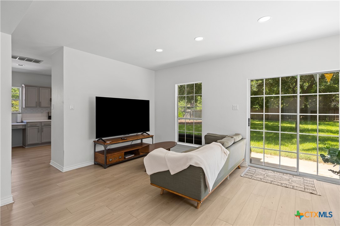 1710 Greening Way Leander, TX 78641 - Photo 3 of 47 a living room with furniture and a flat screen tv