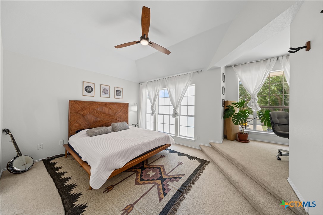 1710 Greening Way Leander, TX 78641 - Photo 32 of 47 a bedroom with a bed and a large window