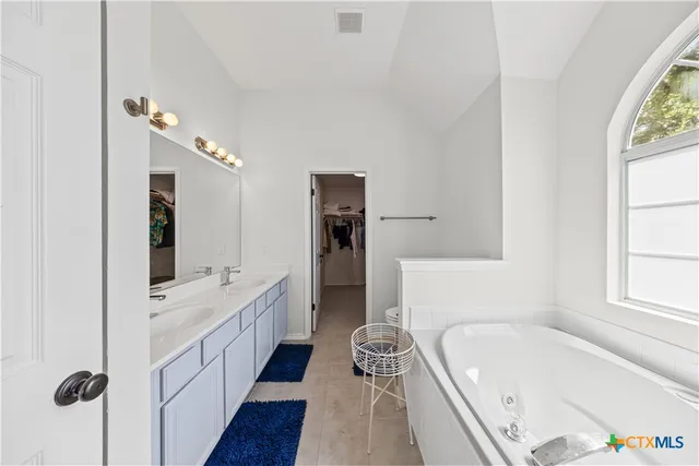 a en suite bathroom with a sink a toilet and shower