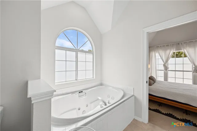 a bathroom with a sink vanity and a mirror