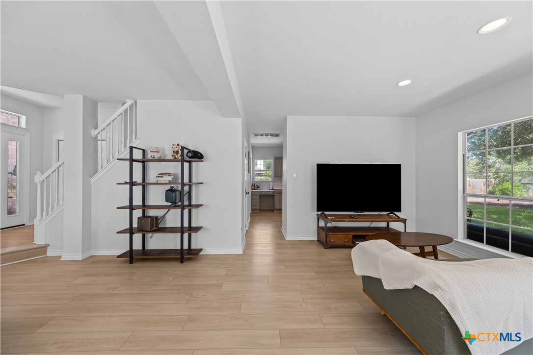 1710 Greening Way Leander, TX 78641 - Photo 9 of 47 a living room with furniture and a flat screen tv