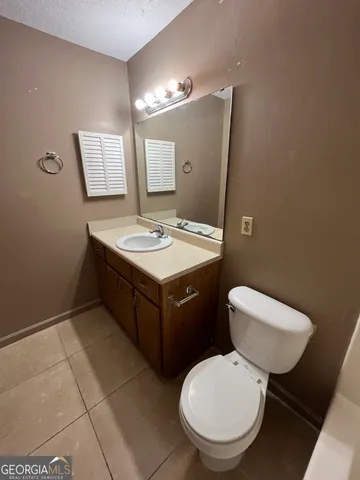 a white toilet sitting next to a bath tub