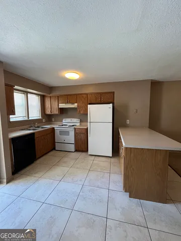 a kitchen with a cabinets and counter space