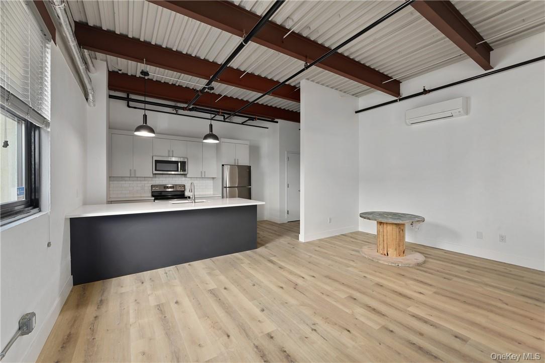189 North Main Street, Unit 6 Port Chester, NY 10573 - Photo 6 of 11 a kitchen with a refrigerator and a sink