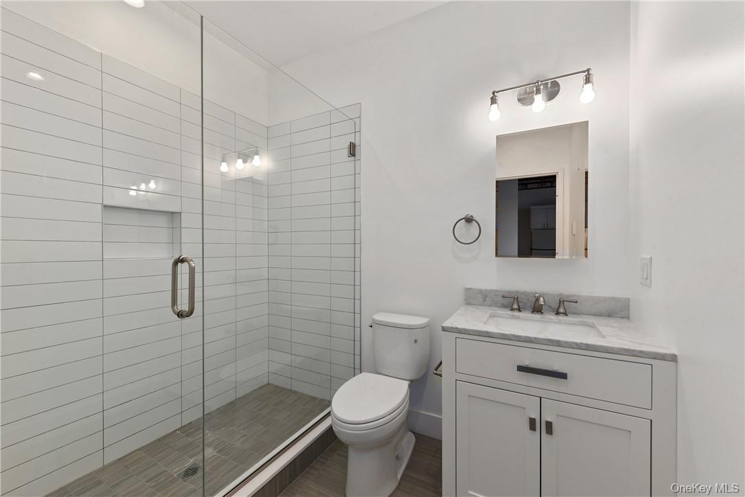 189 North Main Street, Unit 6 Port Chester, NY 10573 - Photo 7 of 11 a bathroom with a sink toilet and shower