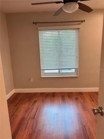 a white toilet sitting next to a bath tub