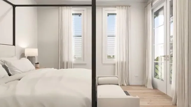 a bedroom with a bed and a night stand