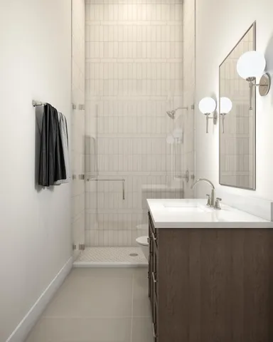 a spacious bedroom with a bed and a couch