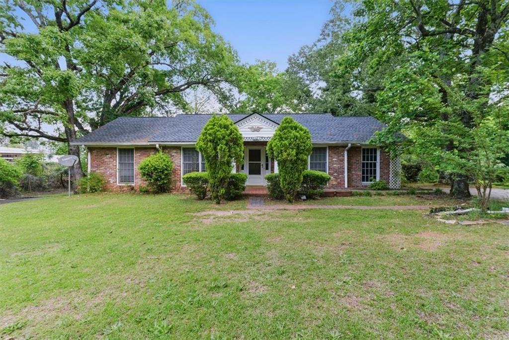 2105 Rockmart Road Southeast Rome, GA 30161 - Photo 1 of 1 a front view of a house with a yard