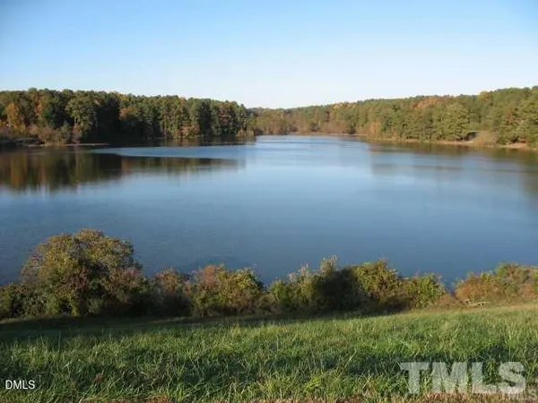 a view of a lake with a yard