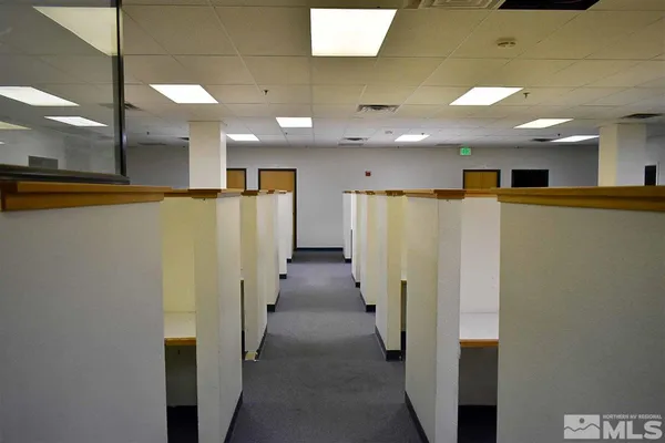 a view of a hallway with a refrigerator
