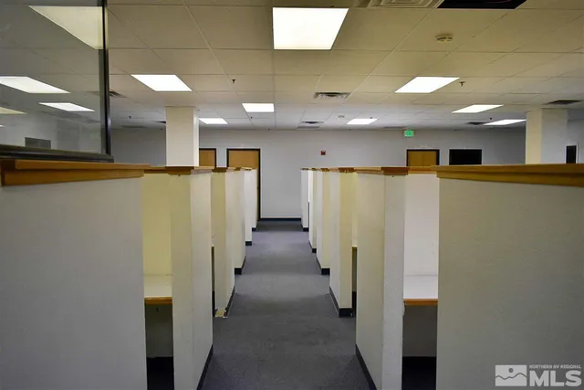 a view of a hallway with a refrigerator