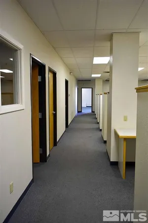 a view of a hallway with windows