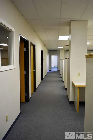 a view of a hallway with windows