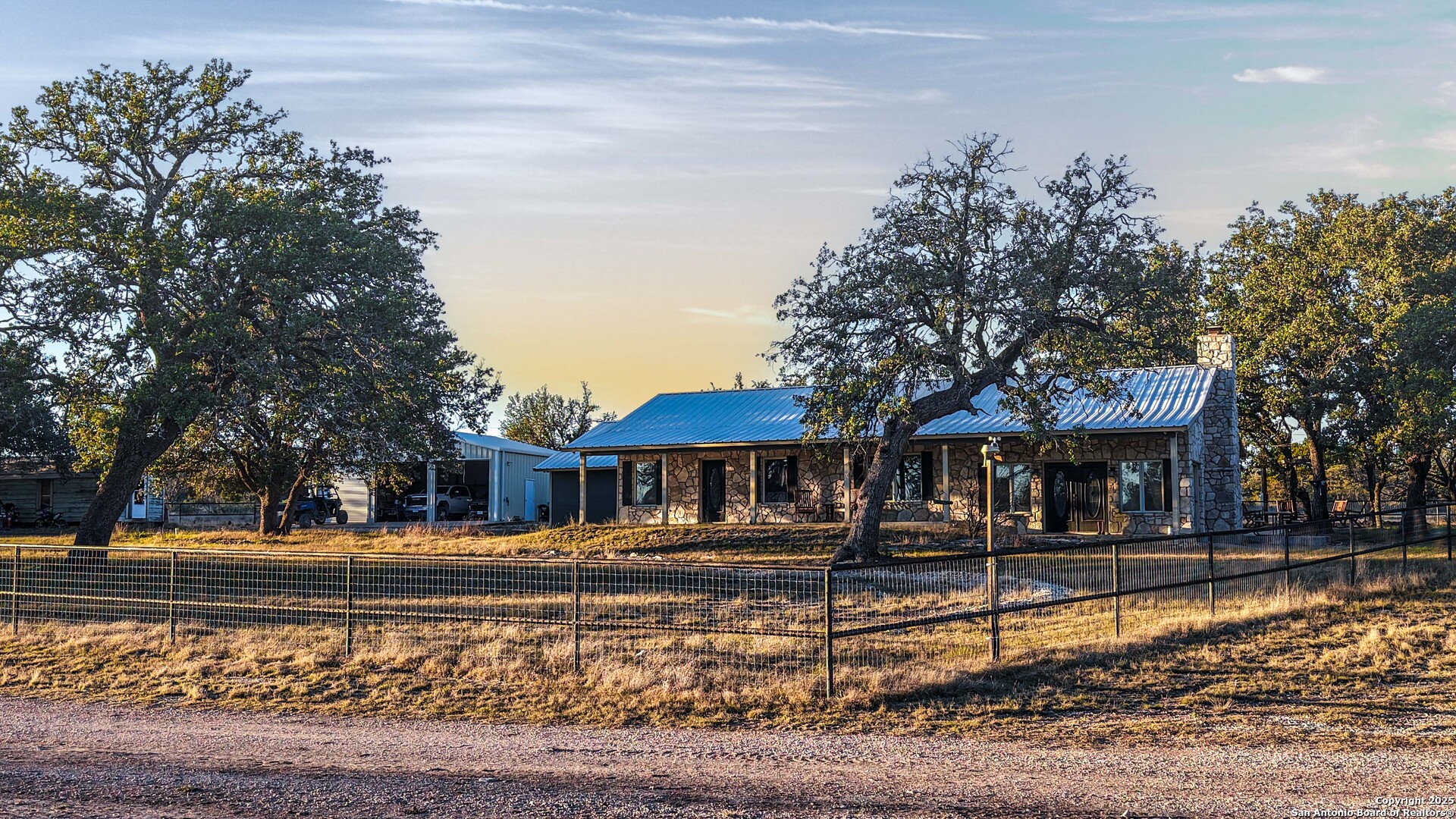 a front view of a building with a yard
