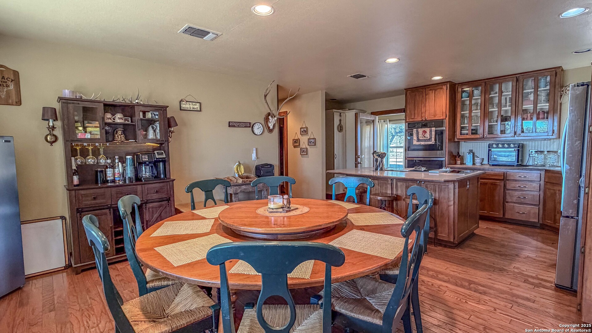 1950 Tolles Road Menard, TX 76859 - Photo 13 of 54 a dining room with stainless steel appliances a table and chairs