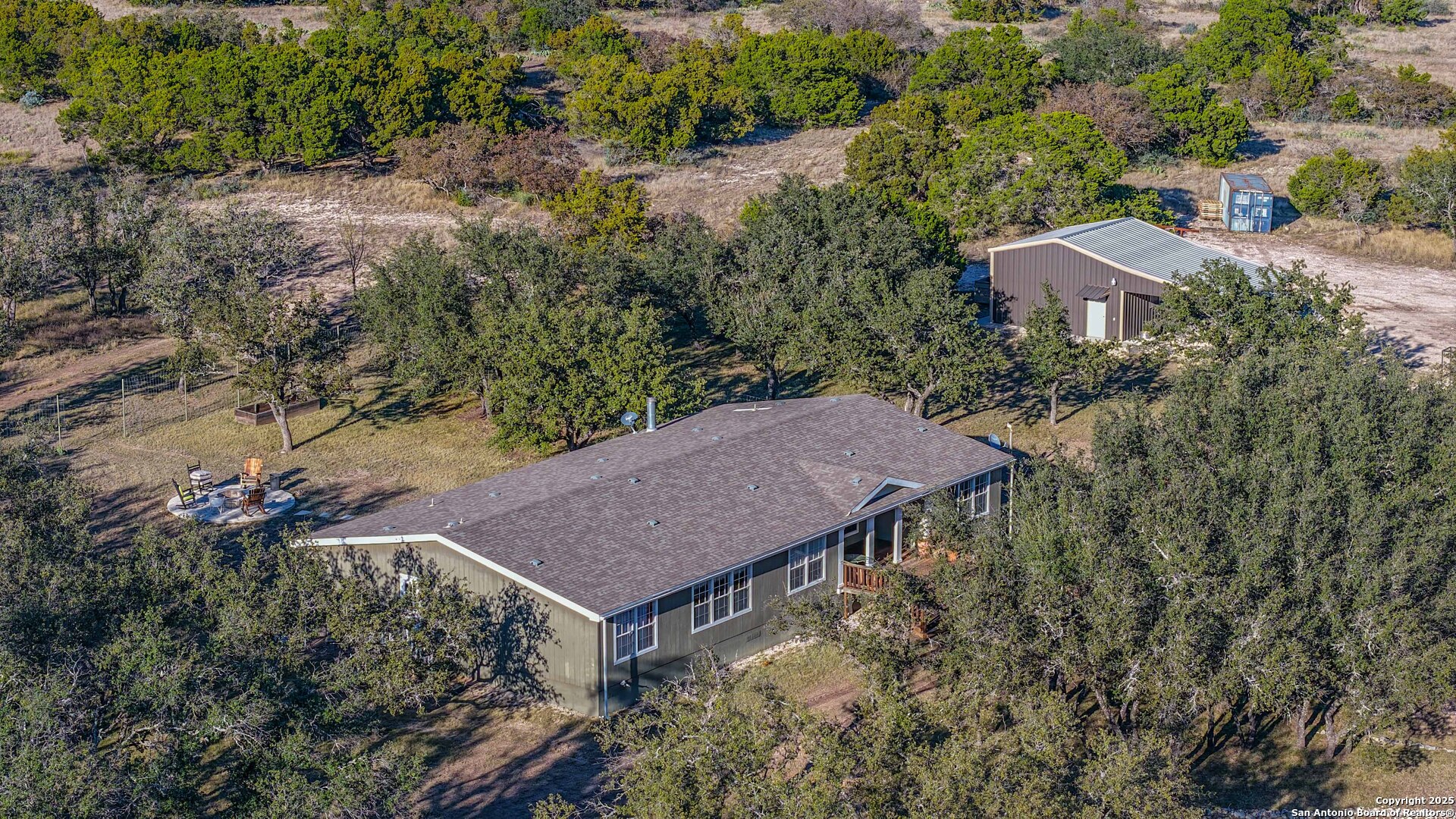 1950 Tolles Road Menard, TX 76859 - Photo 21 of 54 an aerial view of house with yard and trees in the background