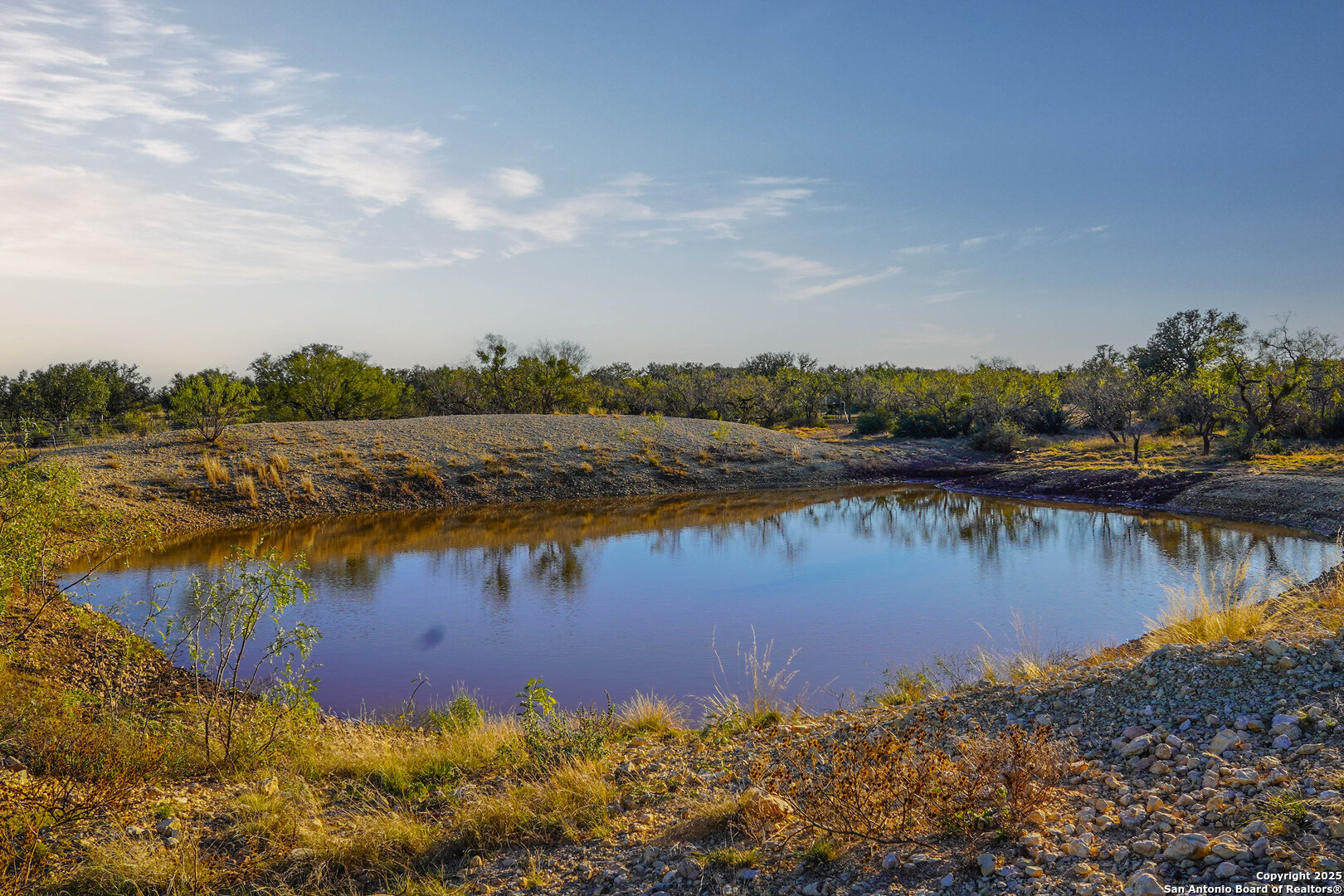 1950 Tolles Road Menard, TX 76859 - Photo 42 of 54 a view of a lake with houses in the back