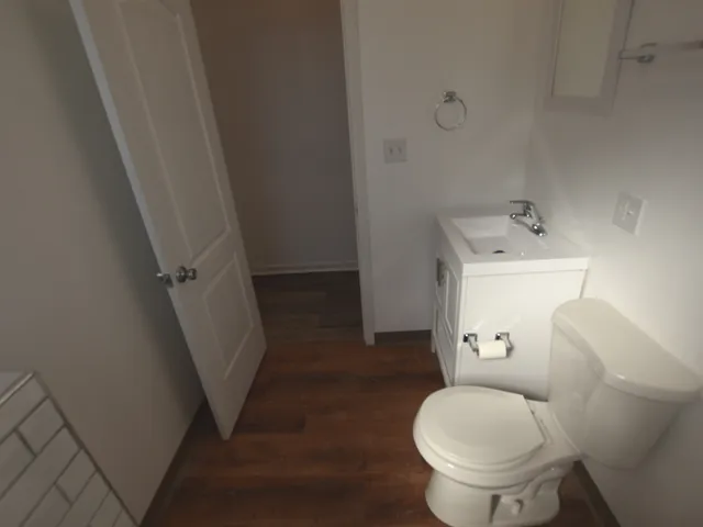 a bathroom with a toilet and a sink