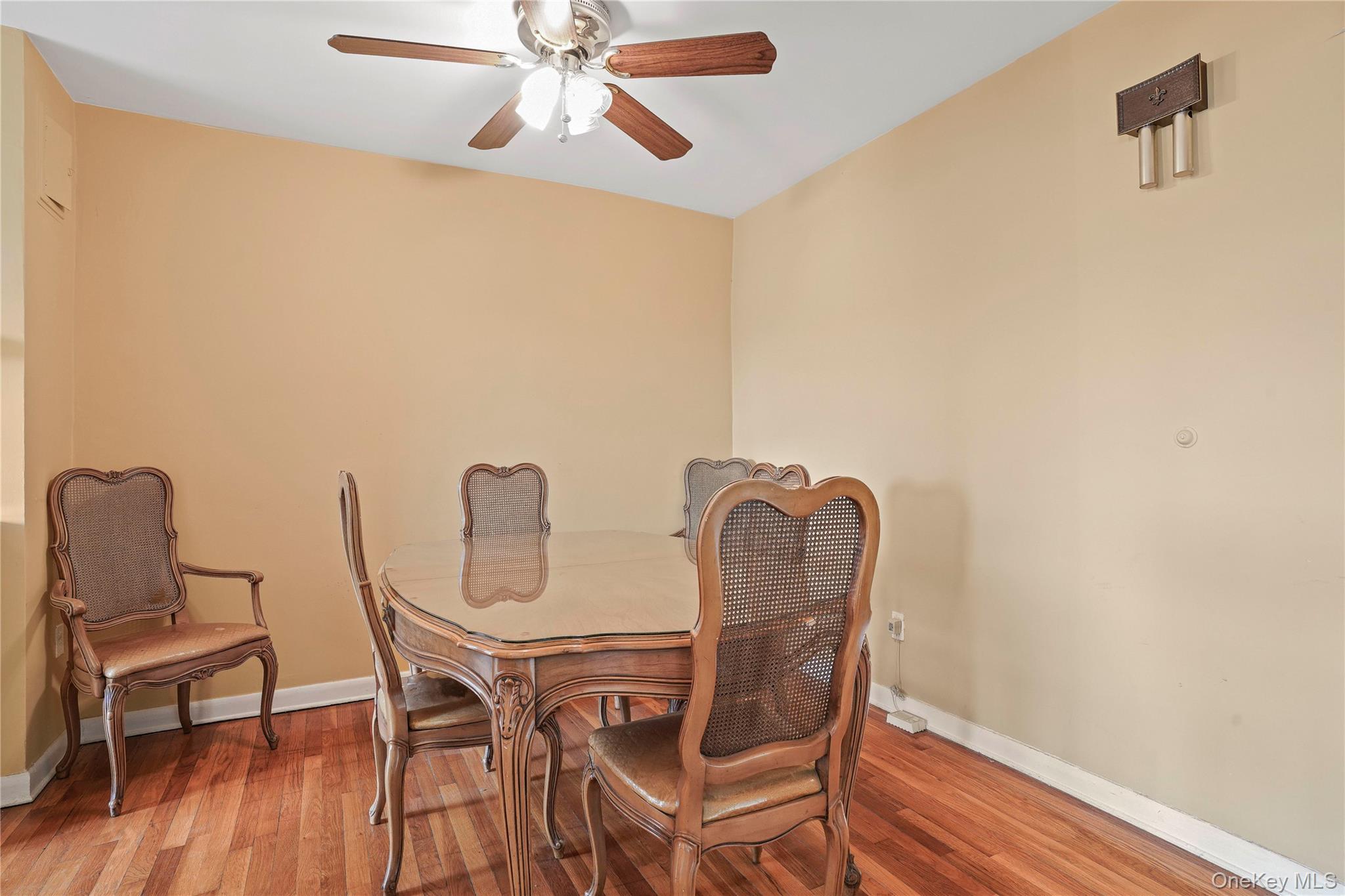60-35 75th Street Queens, NY 11379 - Photo 16 of 29 a dining room with furniture and wooden floor