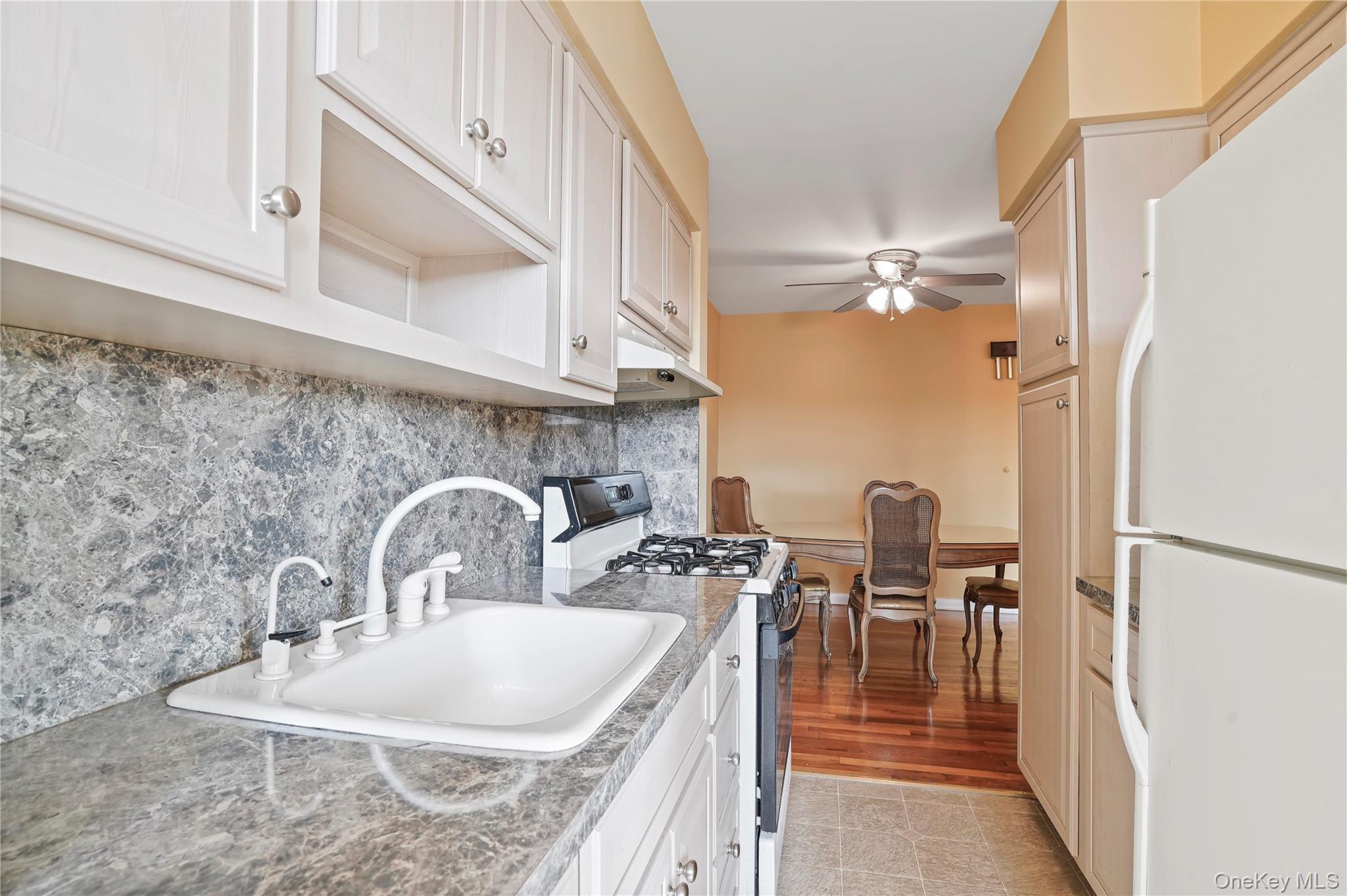 60-35 75th Street Queens, NY 11379 - Photo 20 of 29 a dining table with chairs and painted walls