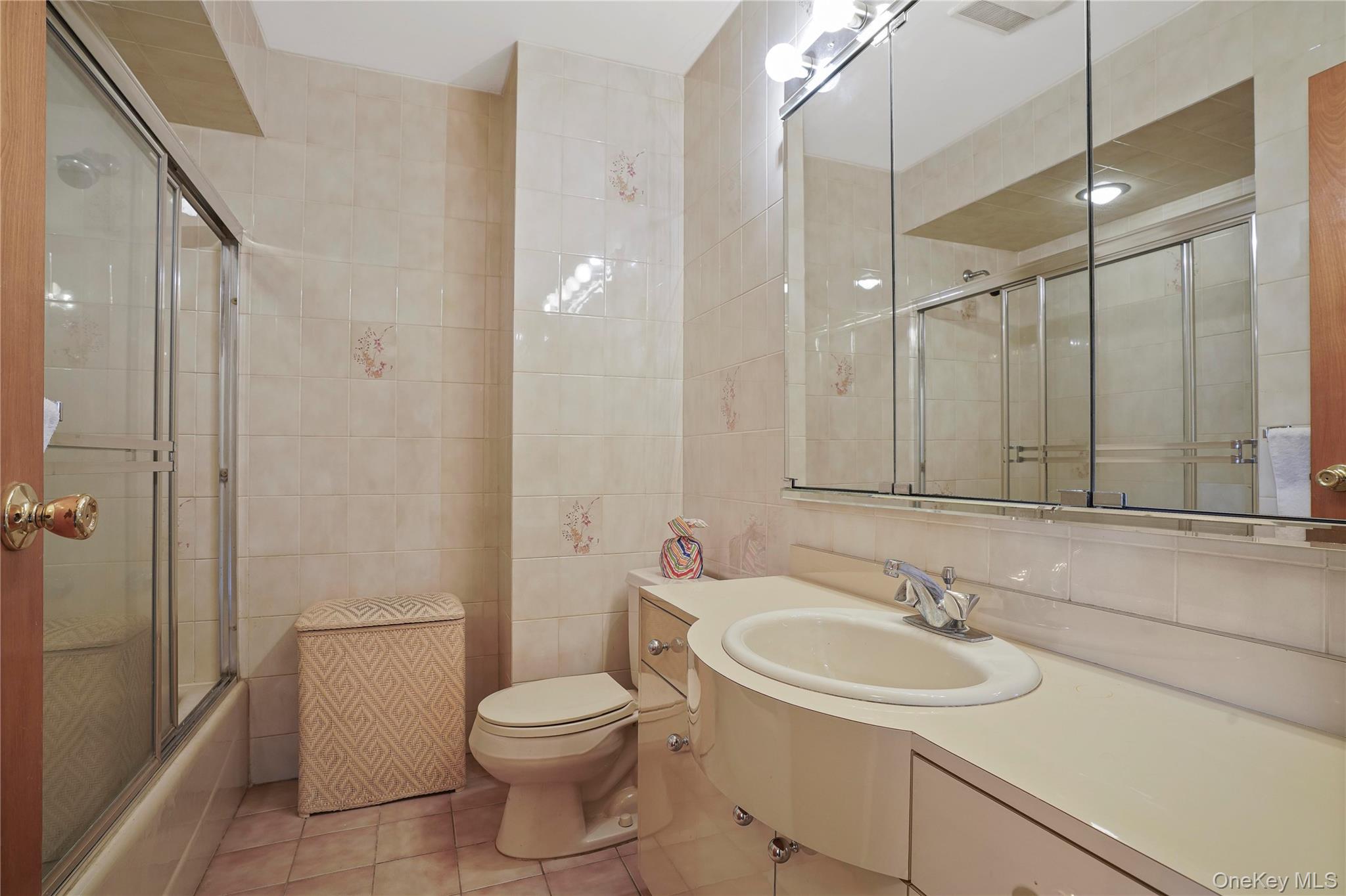 60-35 75th Street Queens, NY 11379 - Photo 26 of 29 a bathroom with a sink toilet and shower