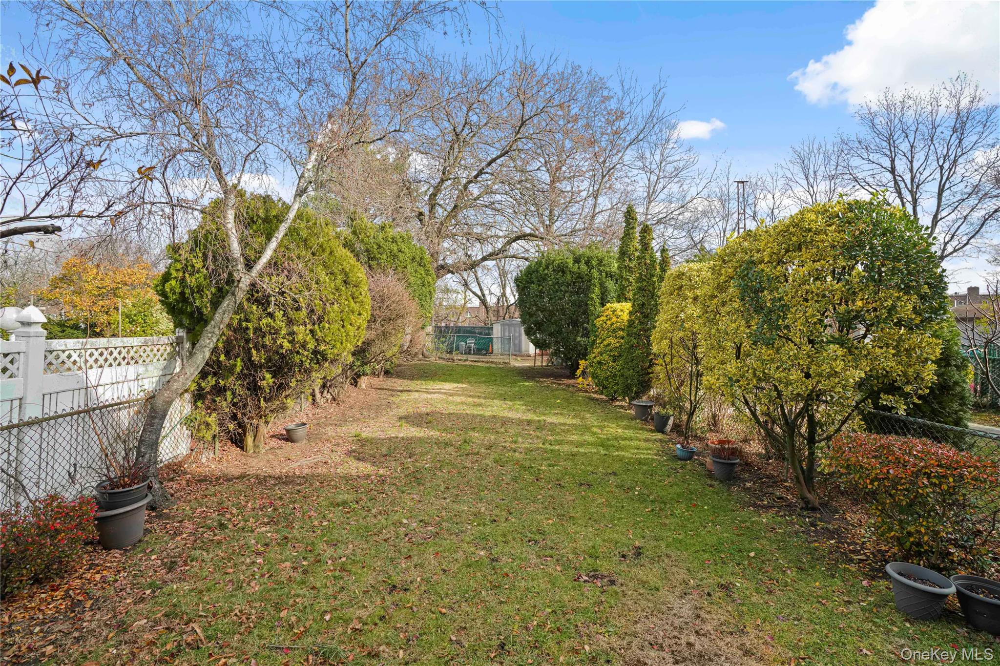 60-35 75th Street Queens, NY 11379 - Photo 27 of 29 a view of yard with green space