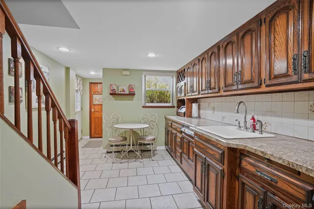 a kitchen with stainless steel appliances granite countertop a sink and cabinets