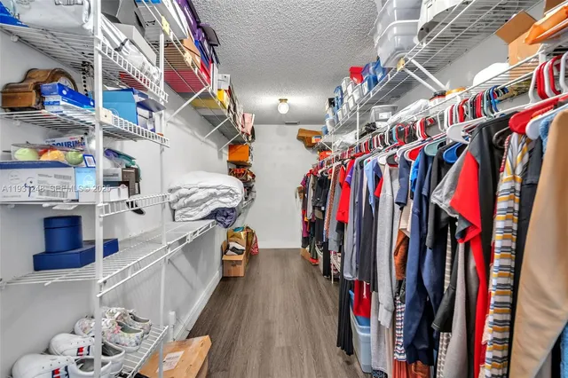 a view of a closet with storage