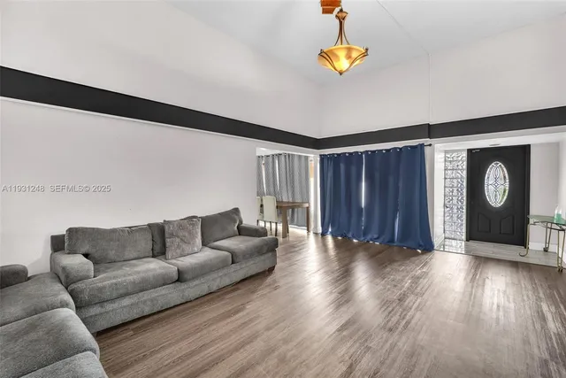 a living room with couches and a coffee table