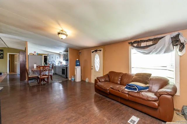a kitchen with stainless steel appliances granite countertop a stove and a refrigerator