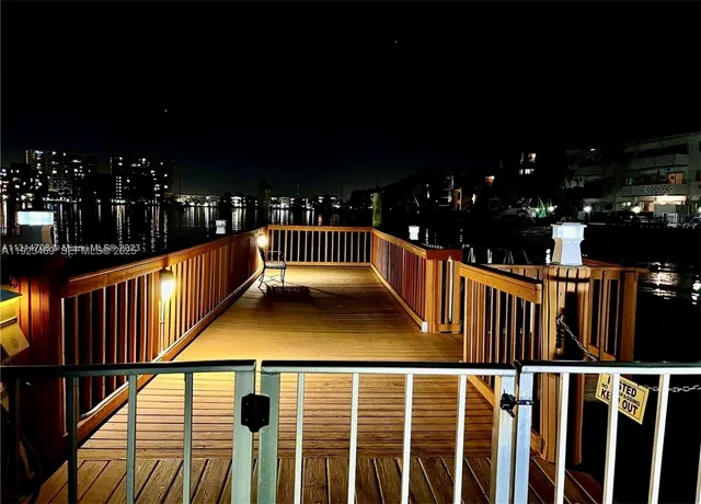 a balcony with lots of swimming pool and wooden floor