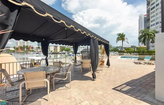 a view of a swimming pool with a patio