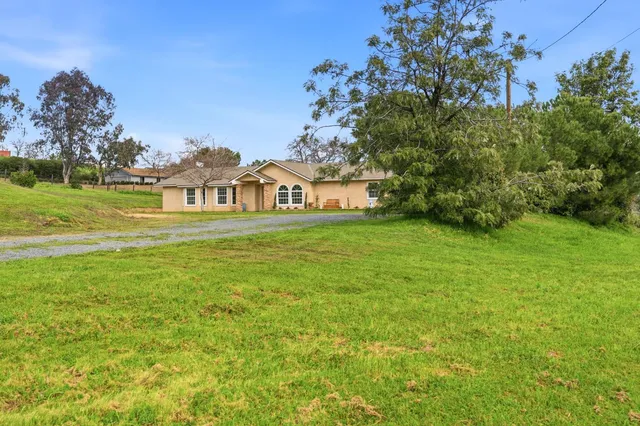 a view of a city with tall buildings and a big yard