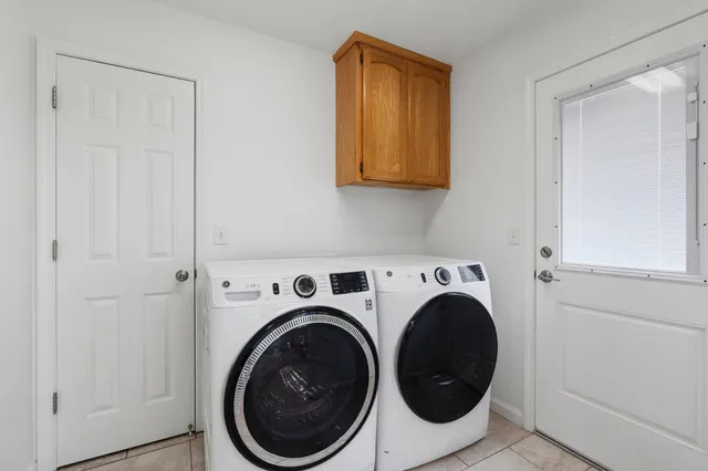 a utility room with dryer and washer