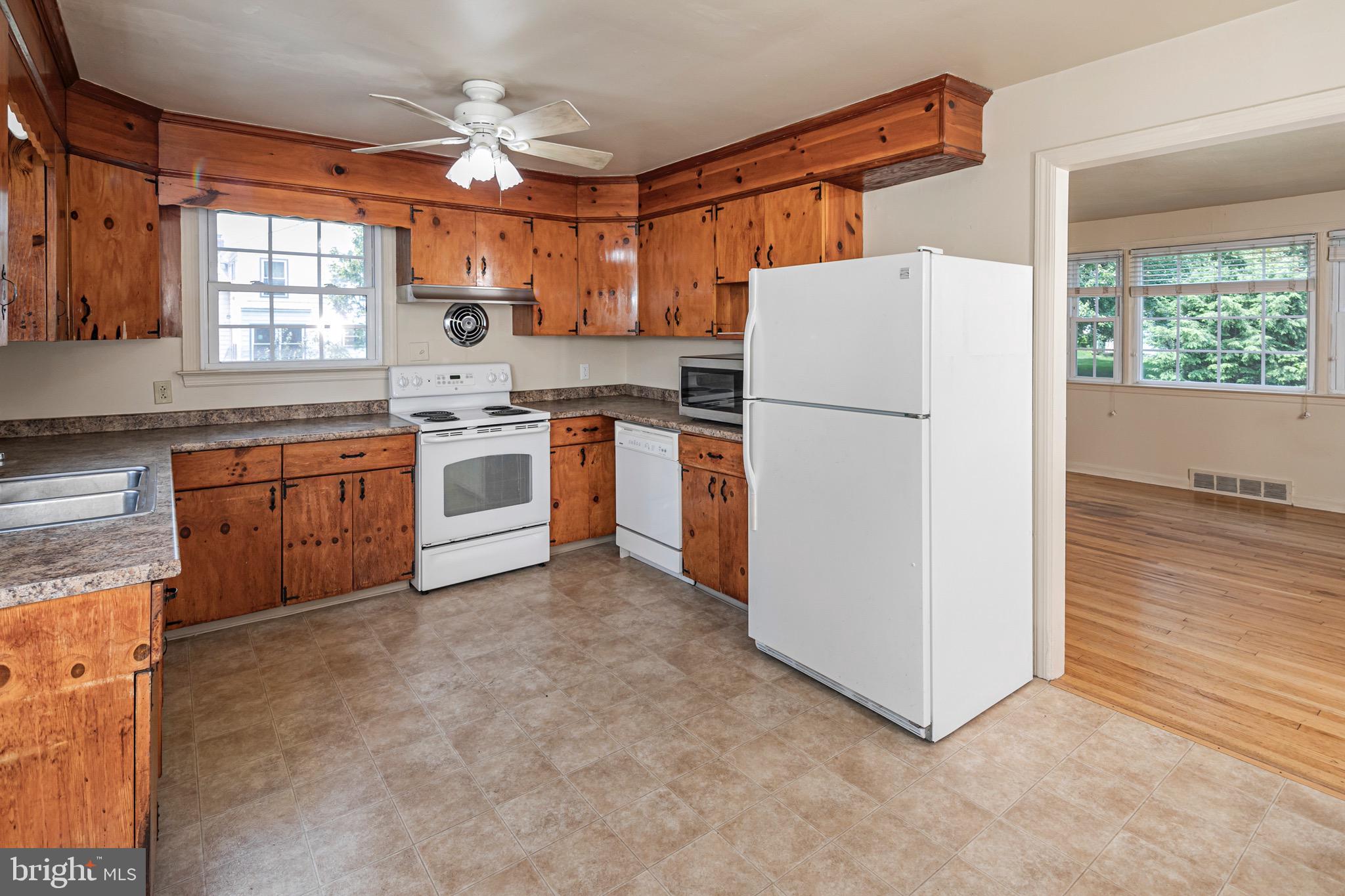 15 Hillside Road Princeton, NJ 08540 - Photo 10 of 30 a kitchen with a refrigerator a stove top oven a sink and dishwasher