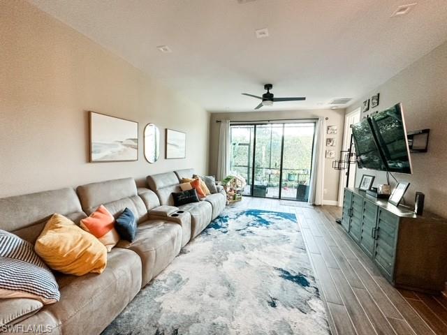 7537 Carnegie Way Naples, FL 34119 - Photo 11 of 35 a large bedroom with a bed and glass windows