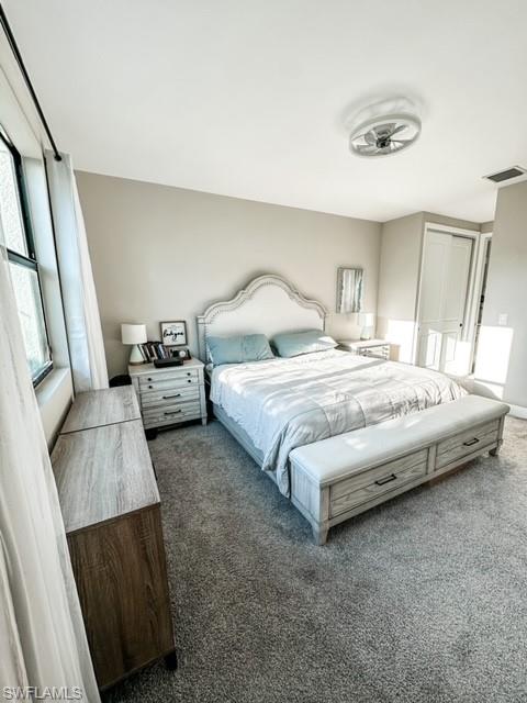 7537 Carnegie Way Naples, FL 34119 - Photo 15 of 35 a bedroom with a bed and a couch