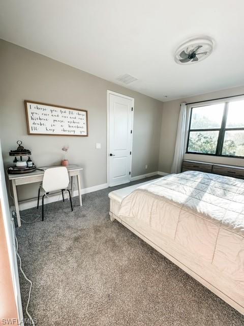 7537 Carnegie Way Naples, FL 34119 - Photo 16 of 35 a bedroom with a bed and a chair