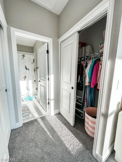 7537 Carnegie Way Naples, FL 34119 - Photo 22 of 35 a view of a hallway with wooden floor and furniture