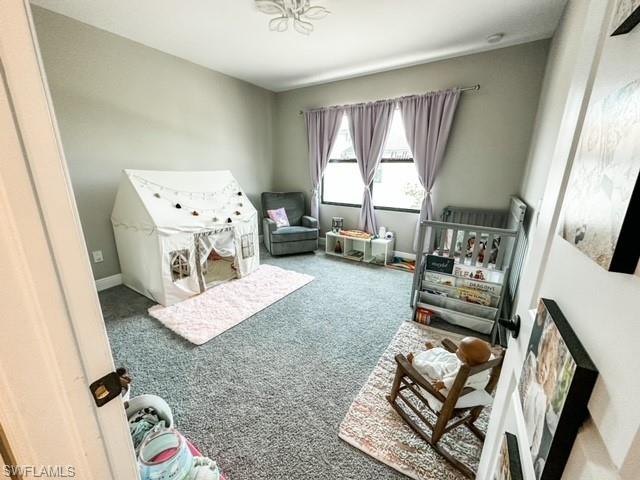 7537 Carnegie Way Naples, FL 34119 - Photo 24 of 35 a living room with furniture and a window