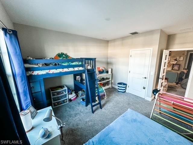 7537 Carnegie Way Naples, FL 34119 - Photo 25 of 35 a view of a room with gym equipment