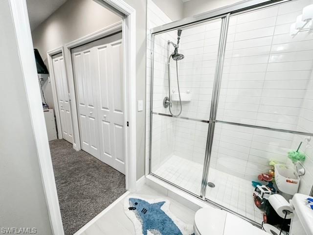 7537 Carnegie Way Naples, FL 34119 - Photo 28 of 35 a bathroom with a shower and a tub
