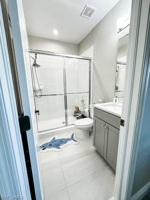 7537 Carnegie Way Naples, FL 34119 - Photo 29 of 35 a bathroom with a bathtub sink and a toilet