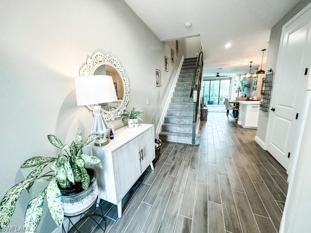 7537 Carnegie Way Naples, FL 34119 - Photo 3 of 35 a living room with furniture and a potted plant