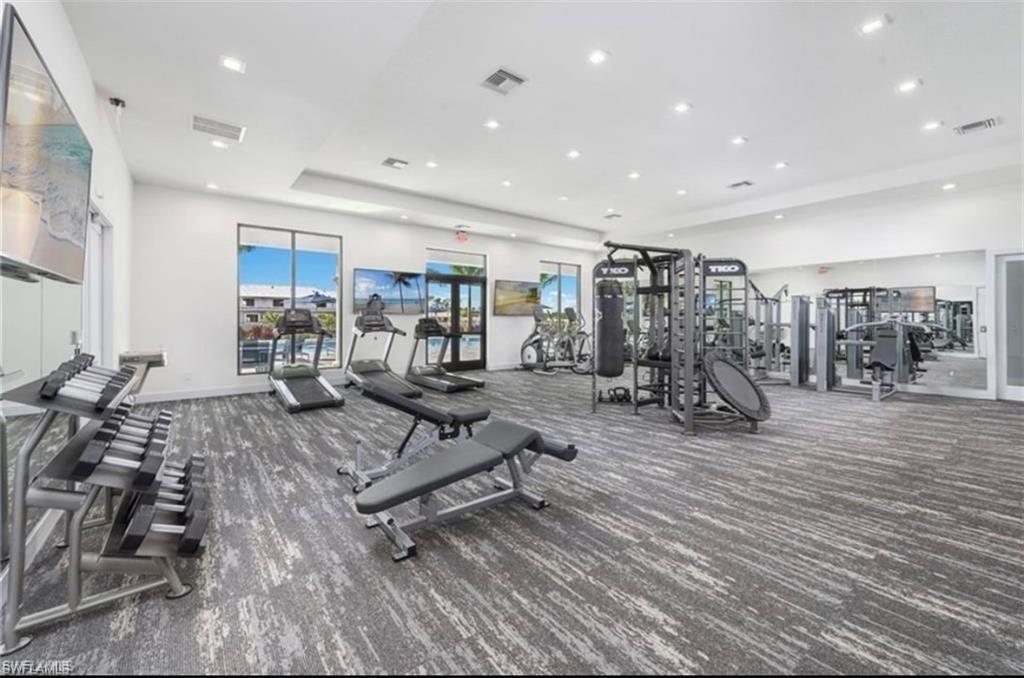 7537 Carnegie Way Naples, FL 34119 - Photo 32 of 35 a view of a room with gym equipment