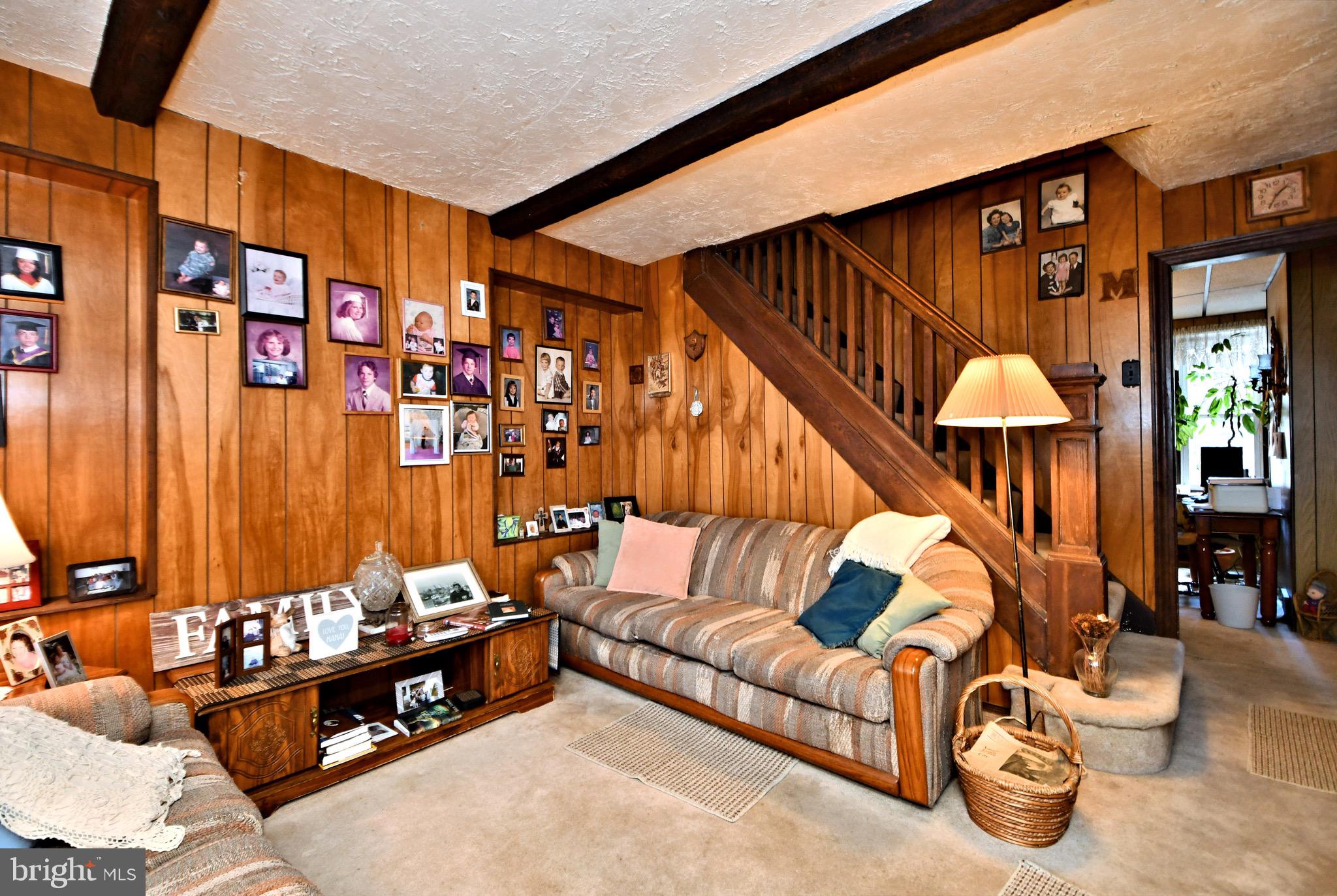 447 Ripka Street Philadelphia, PA 19128 - Photo 5 of 44 a living room with furniture a lamp and a large window