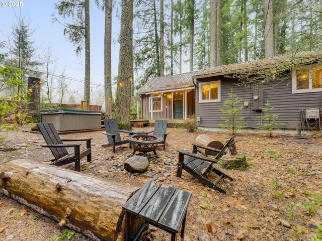 a house view with a sitting space and garden