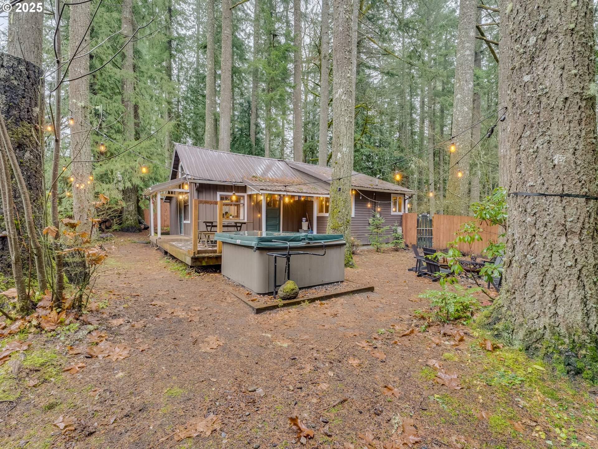 71597 East Minikahda Avenue Rhododendron, OR 97049 - Photo 23 of 26 a house view with a sitting space and garden