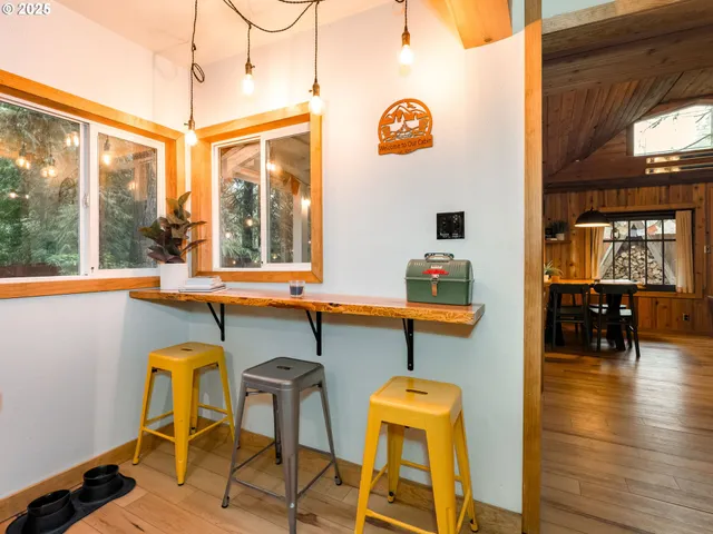 a view of a dining room with furniture and window